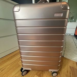 Away Aluminum luggage in rose gold